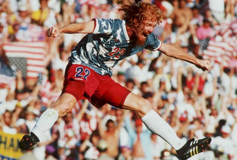 FILES,- JUNE 22:  US national team defender Alexi Lalas jumps in the air 22 June 1994 as he celebrates after the US defeated Colombia in their World Cup match at the Rose Bowl in Pasadena, California. The US won their match 2-1.  (Photo credit should read PATRICK HERTZOG/AFP via Getty Images)