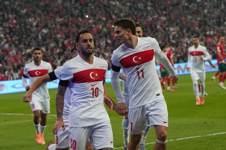ISTANBUL, TURKEY - NOVEMBER 15: Hakan Calhanoglu (10) of Turkey celebrates after scoring the first goal of his team with Arda Guler (8) and Kenan Yildiz (11) during the FIFA World Cup 2026 qualifier match between T&uuml;rkiye and Bulgaria at Buyuksehir Belediye Stadium on November 15, 2025 in Bursa, Turkey. (Photo by Seskim Photo/MB Media/Getty Images)